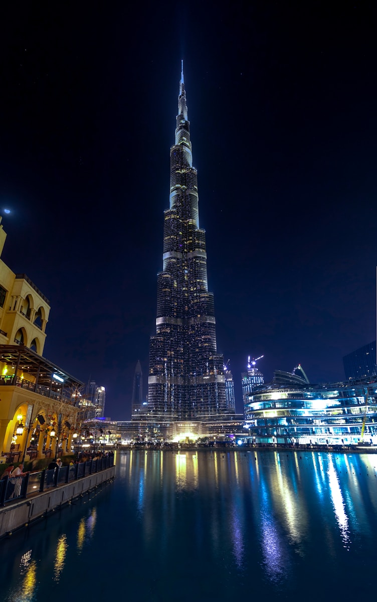 Photo by Mike Swigunski lighted high rise building during night time